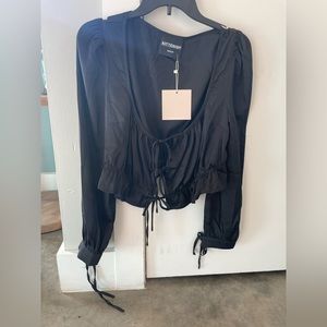 Kittenish Black Silk Blouse. Size Medium. Never worn with tags!